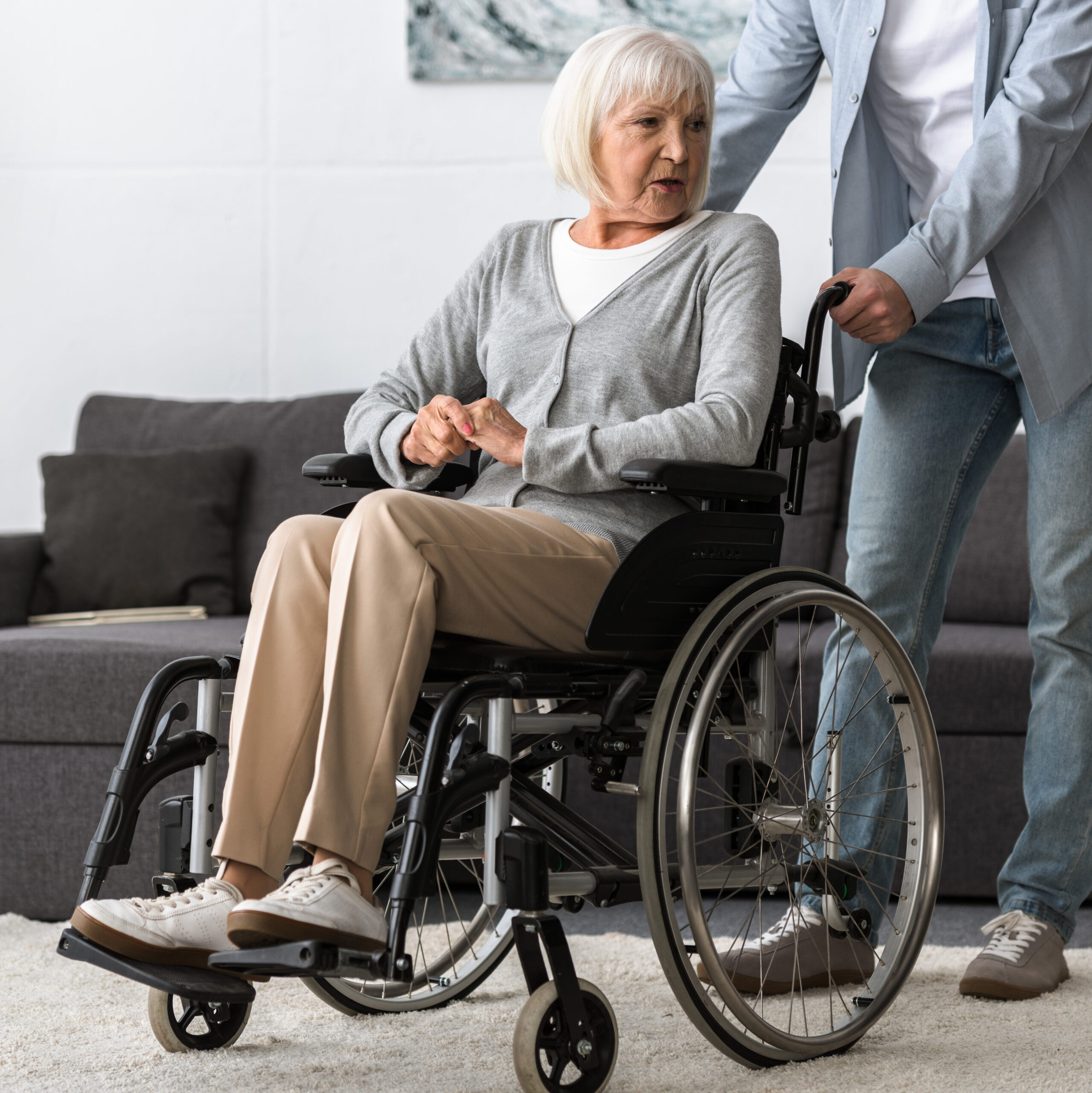 elderly woman being pushed on wheelchair